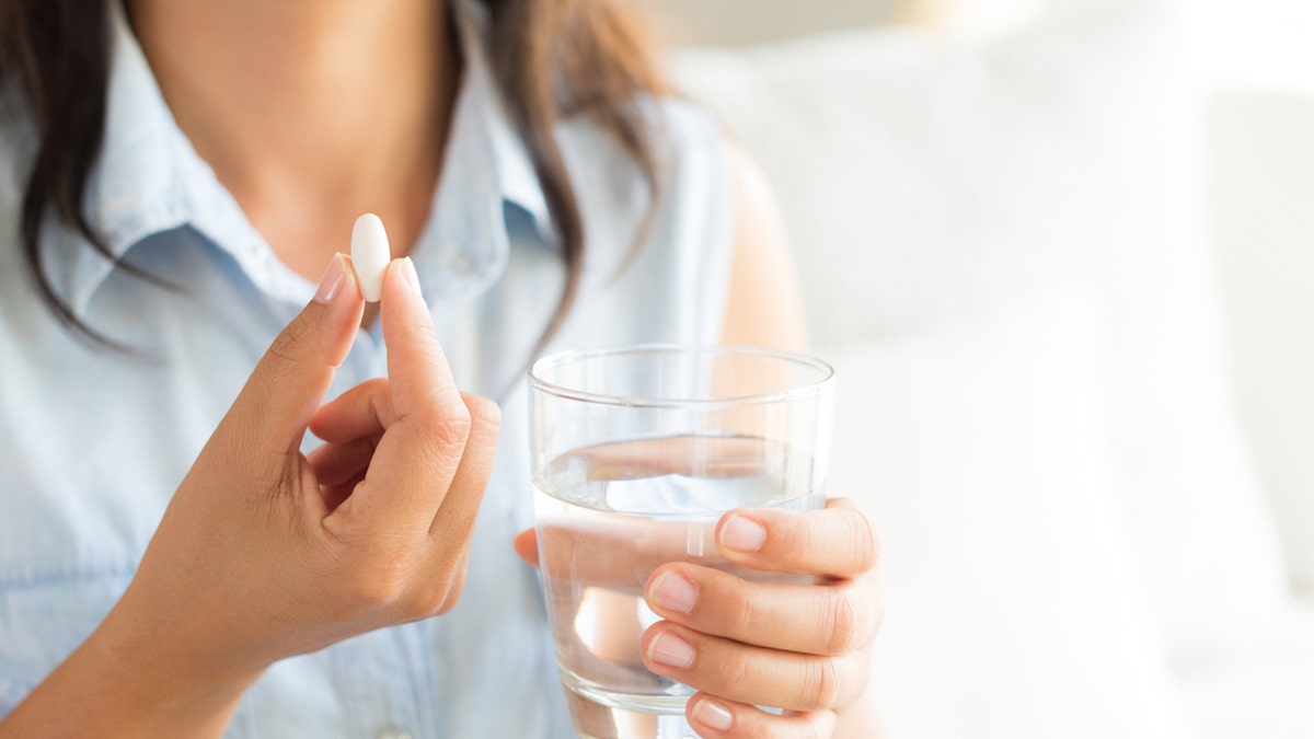 Woman taking supplements