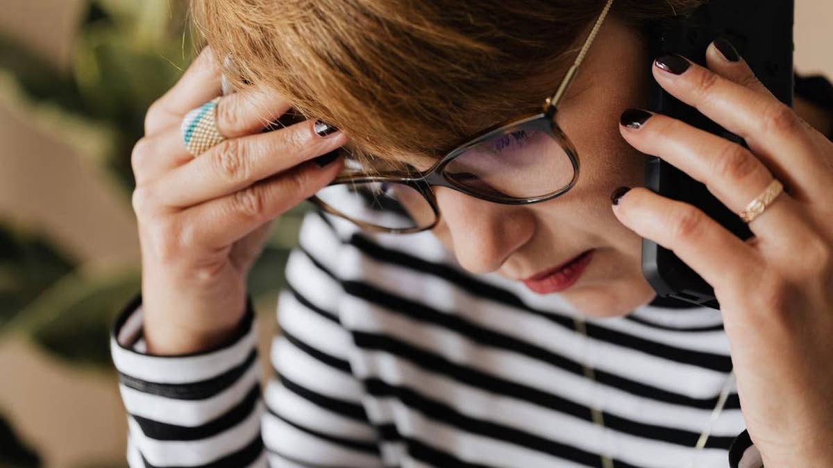 stressed woman on phone