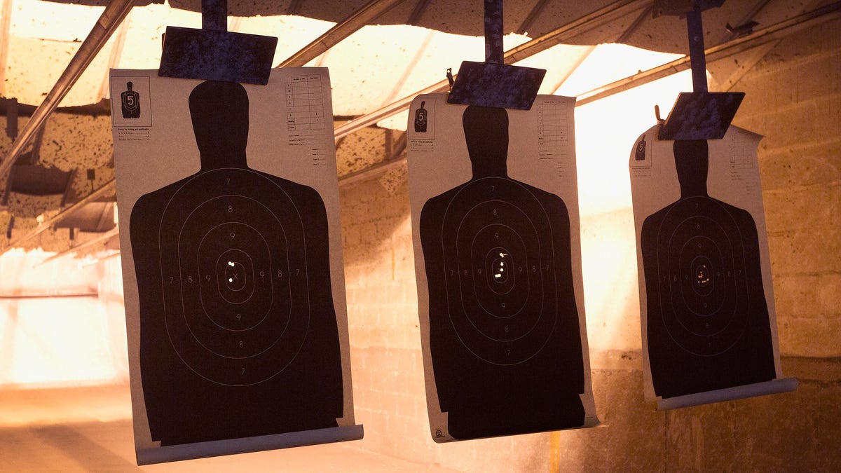 human silhouettes at gun range