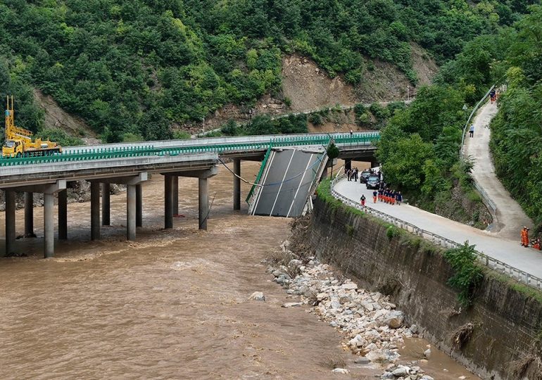 11 dead and dozens missing after a highway bridge in China crumbles in flooding and heavy storms