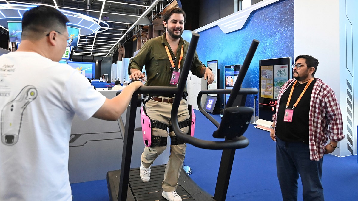 A man using wearable tech on a treadmill.