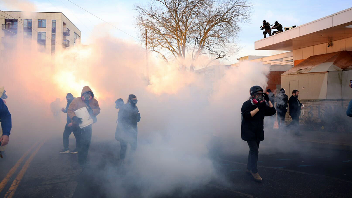Federal agents lobbed tear gas  and flash bangs at protesters