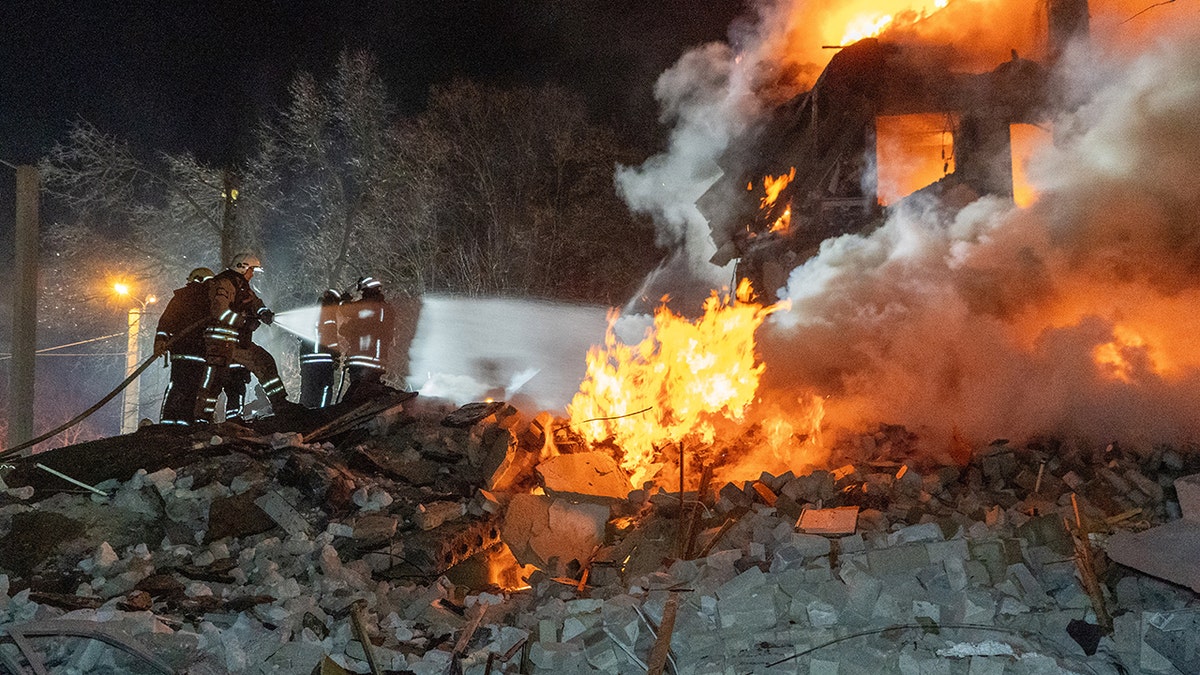 The ruins of an apartment building burn following a Russian missile attack in Kharkiv, Ukraine, on Saturday. 